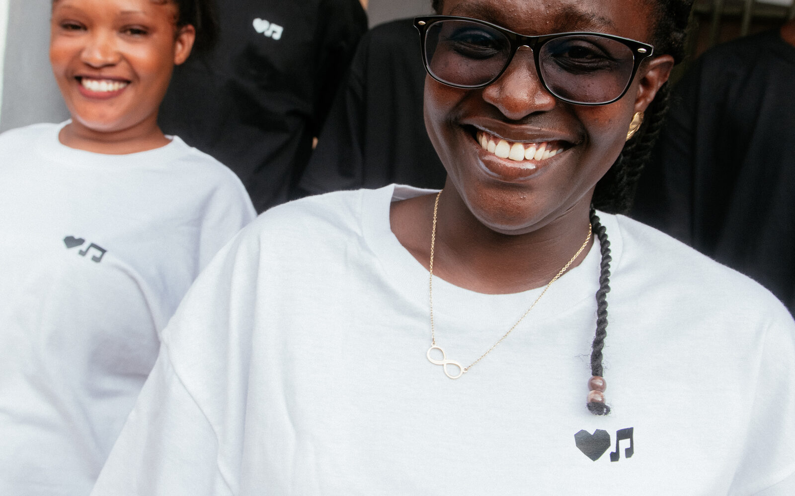 Smiling young person in a white shirt